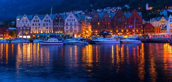 Boats in harbor at night