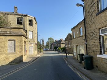 View along, market street, with victorian buildings, and a blue sky in, thornton, bradford, uk