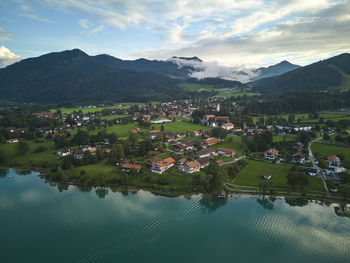 Scenic view of lake and mountains against sky