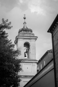 Low angle view of bell tower against sky