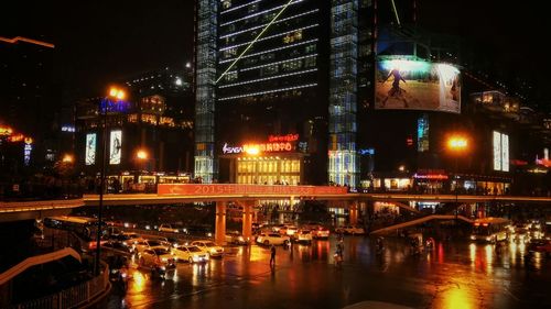 Illuminated street and buildings in city