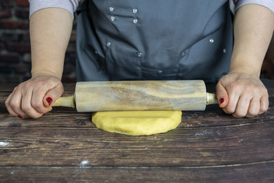 Women preparing delicious apple tart or pie .knead the dough