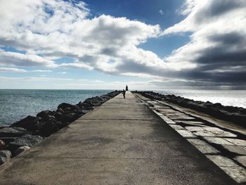 Pier over sea against sky