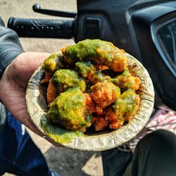 High angle view of person holding food