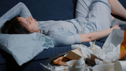 Young woman sleeping on sofa