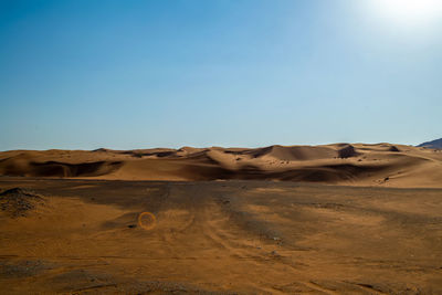 Scenic view of desert against clear sky