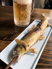 High angle view of beer in glass on table