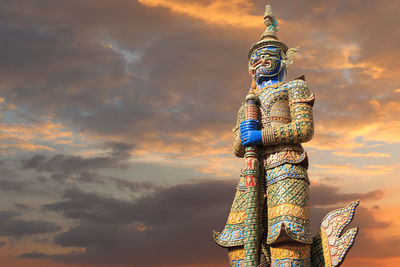 Low angle view of statue against sky during sunset