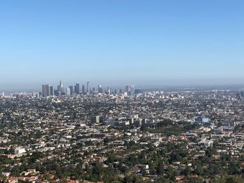 High angle view of modern buildings against clear sky