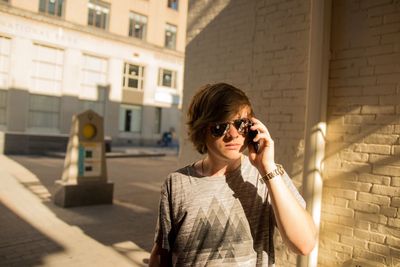 Portrait of young man using phone