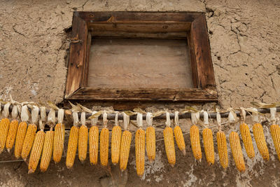 Close-up of corn hanging on farm