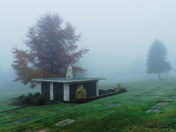 Gazebo on landscape against sky