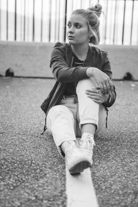 Portrait of woman sitting outdoors