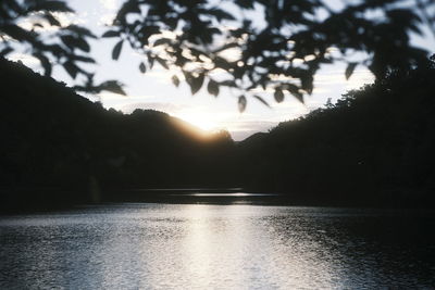 Scenic view of lake against sky during sunset