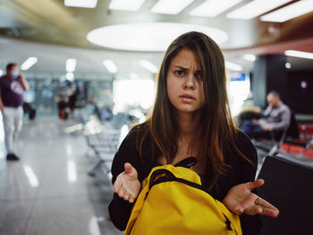 Portrait of woman standing in bus