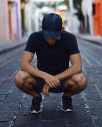 Man sitting on street