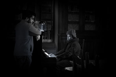 Men in traditional clothing at night