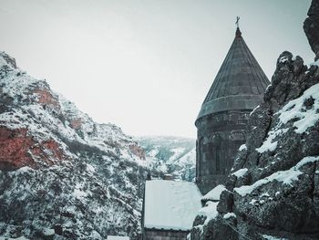 Panoramic view of building against sky during winter