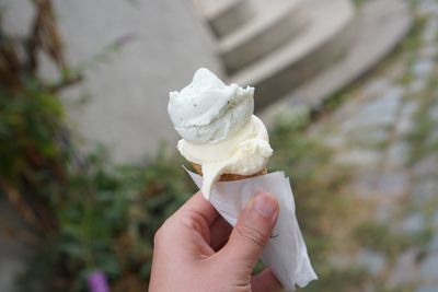 Midsection of person holding ice cream