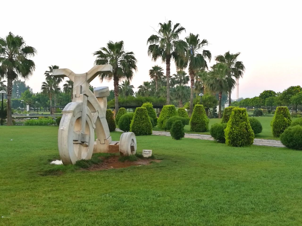 VIEW OF STATUES ON PALM TREES