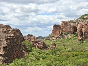 Panoramic view of rock formations against sky