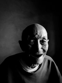 Close-up portrait of senior man at home