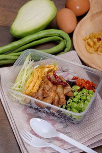 High angle view of vegetables in plate on table