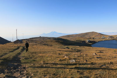 Scenic view of landscape against blue sky