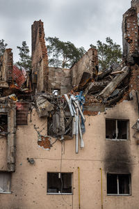 Destroyed buildings on the streets of irpen. broken  windows. buildings after being hit by missiles.