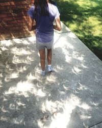 Low section of boy standing on floor