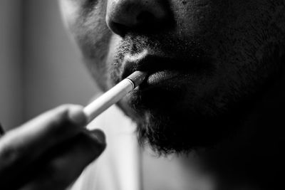 Close-up of man smoking cigarette