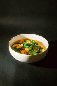 Close-up of soup served on table