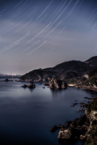 Scenic view of mountains against sky at night