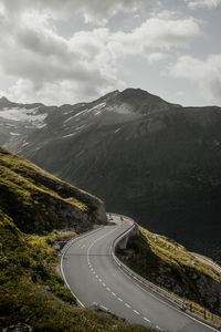 High angle view of road on mountain against cloudy sky