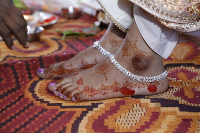 Low section of woman with henna tattoo