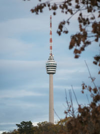 Low angle view of stuttgart tv tower against cloudy sky