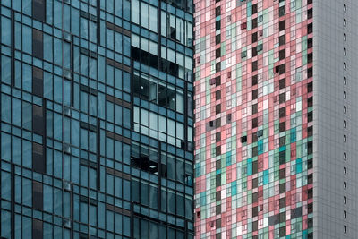 Low angle view of modern glass building in city