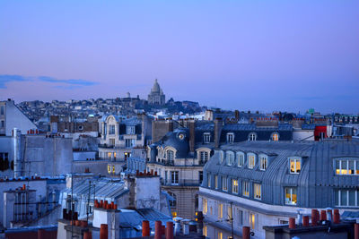 Cityscape against clear blue sky