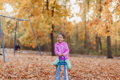 Full length of girl in park during autumn