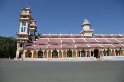 Low angle view of building against blue sky