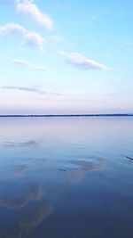 Scenic view of sea against blue sky