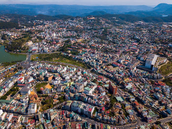 Aerial view of modern buildings in city against sky