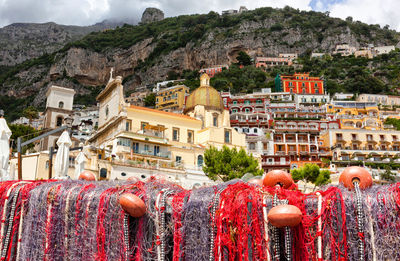 Fishing nets on the beach of positano, italy. view of dome.