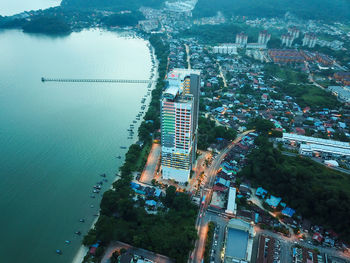 High angle view of buildings and sea in city