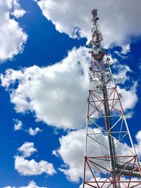 Low angle view of communications tower against sky