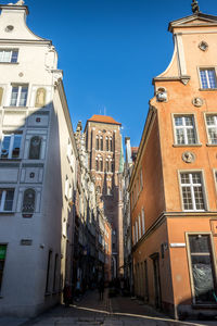 Low angle view of buildings against clear blue sky