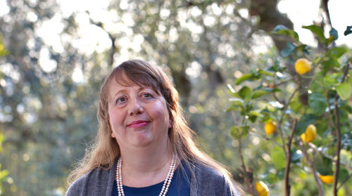 Portrait of woman against plants