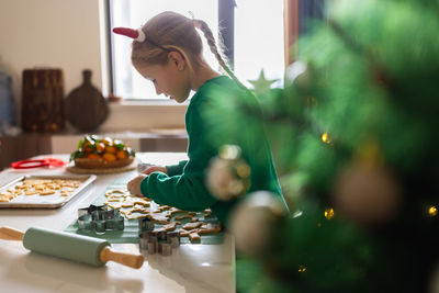 Side view of man preparing food at home