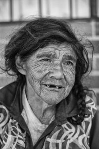 Close-up of smiling senior woman looking away