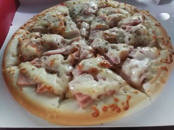 Close-up of pizza served in plate